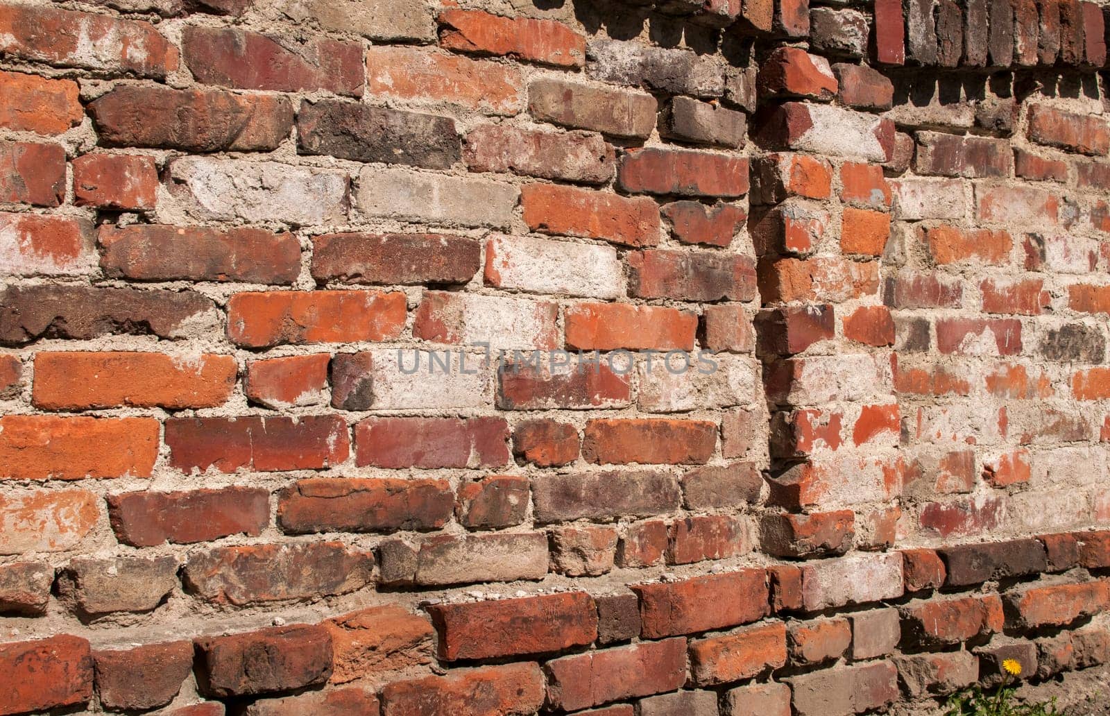 Old weathered grunge brick wall as background