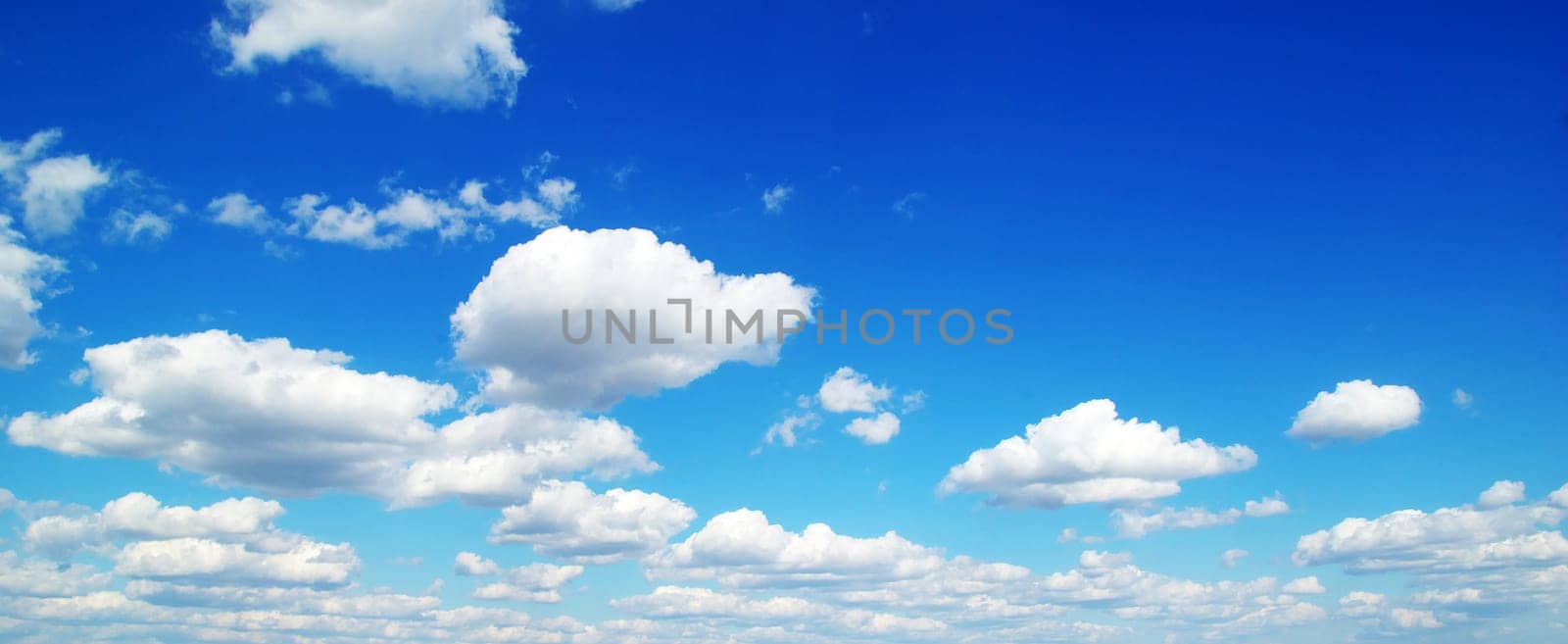 blue sky background with tiny clouds
