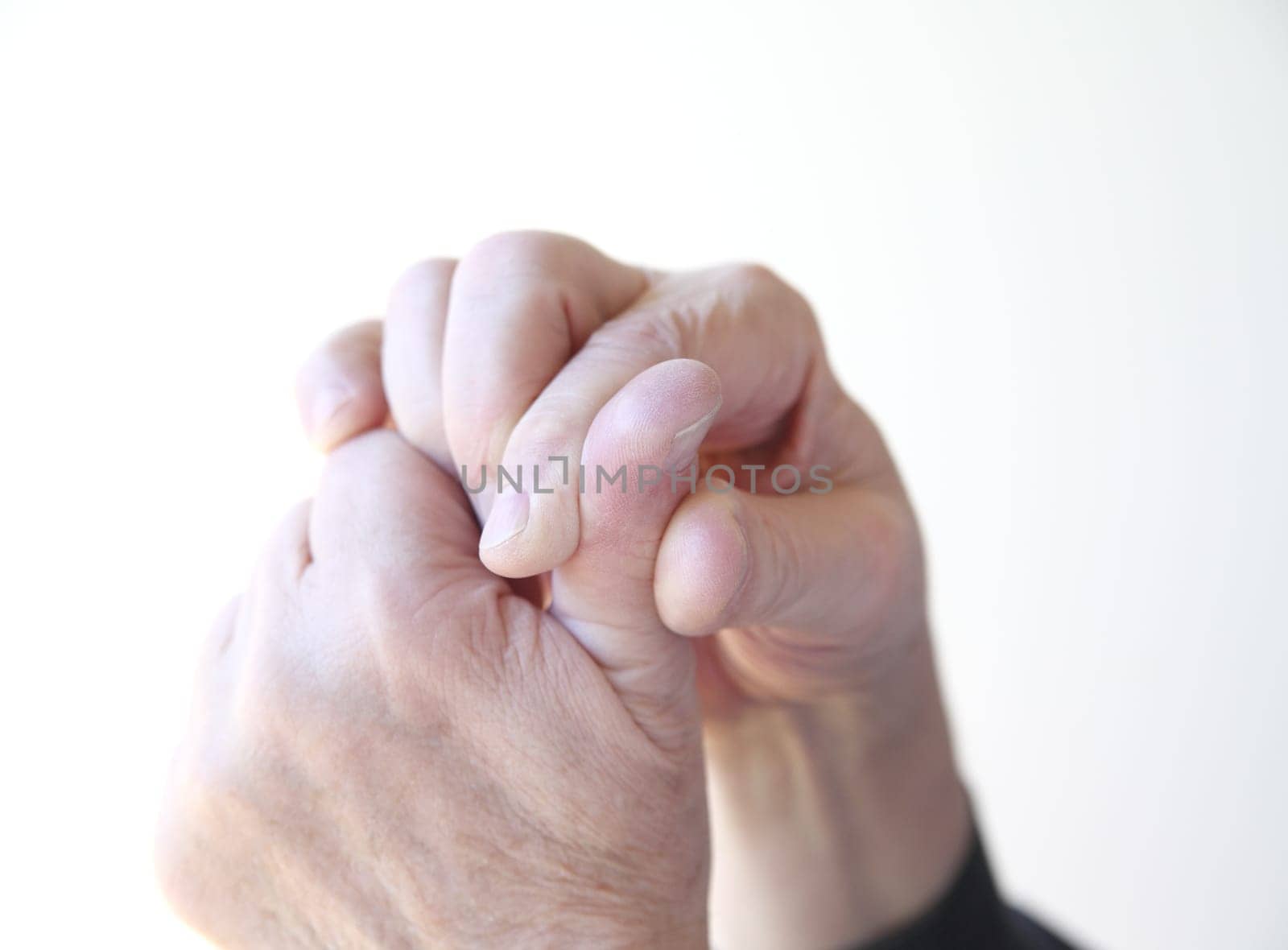 older man with pain in his thumb