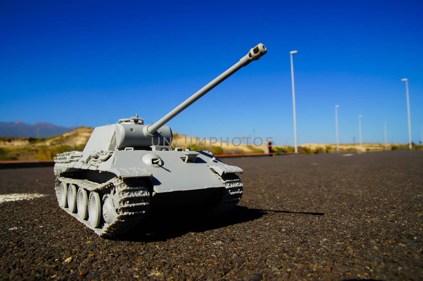 Modern War Concept Model Tank in the Middle of an Asphalt Road