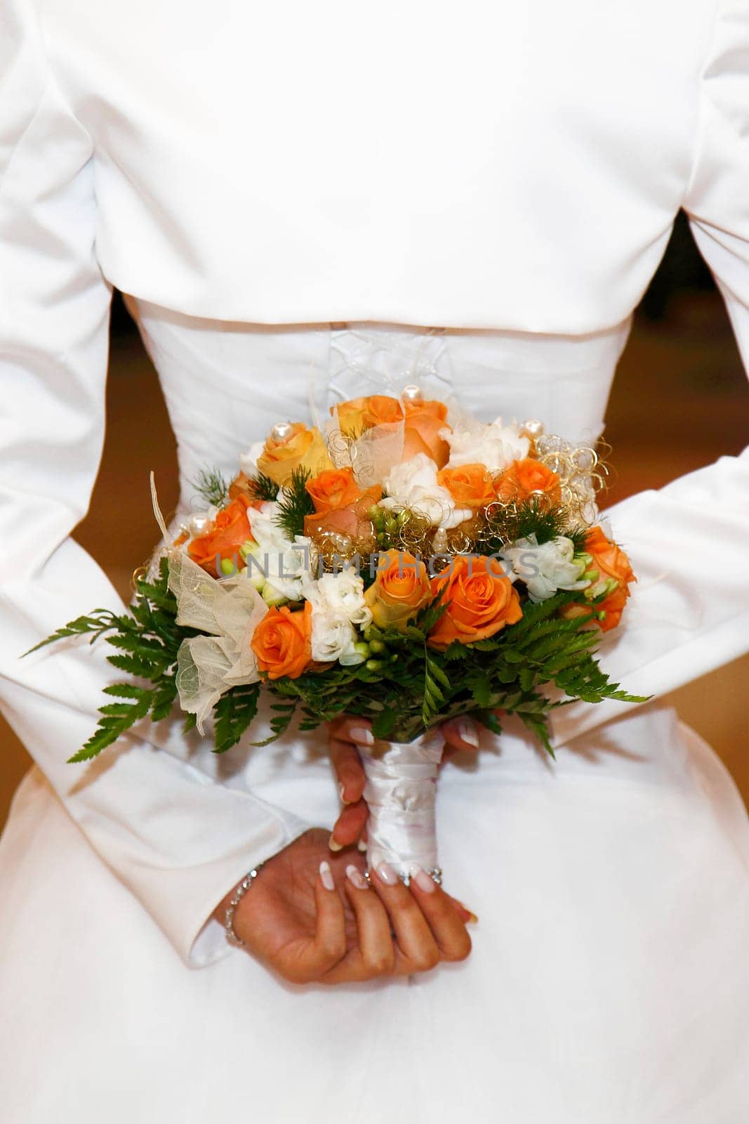 Bride is keeping the bridal bouquet