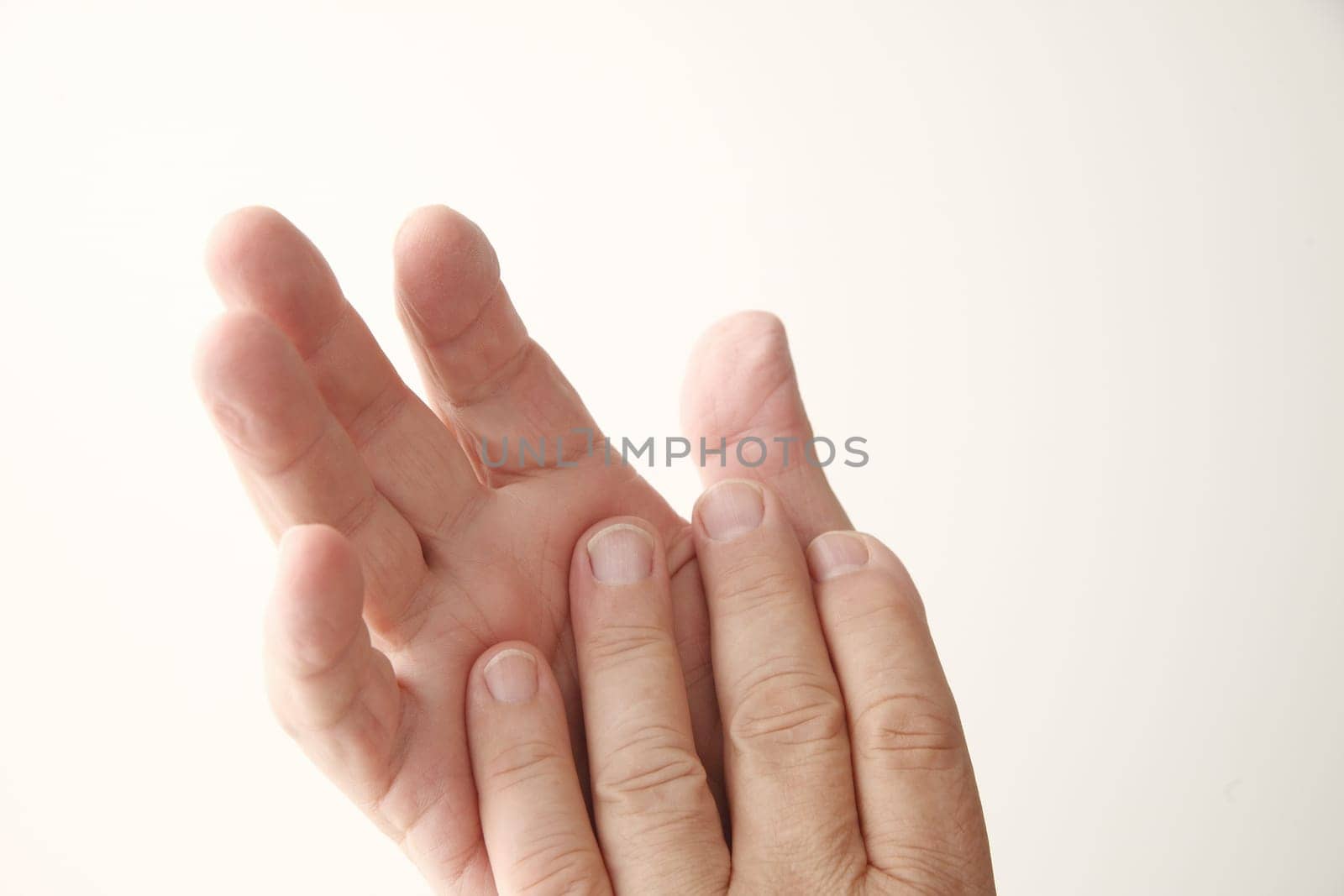 closeup of a 70-year old man's hands