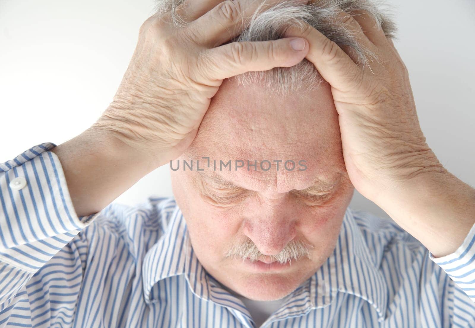 older man is overwhelmed and feeling pressure
