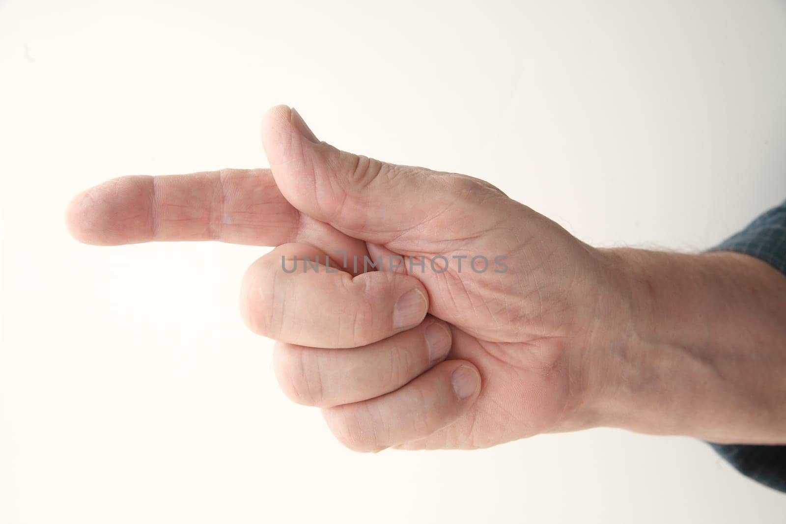 senior man points a finger to the left