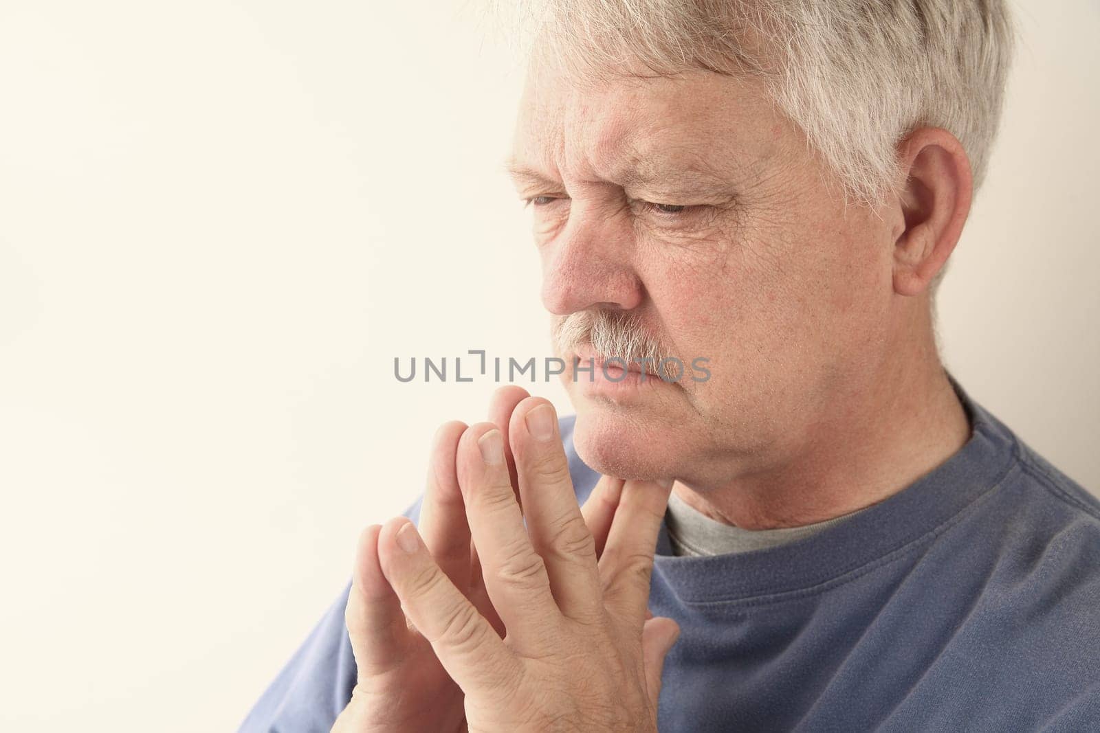 senior man is lost in thought
