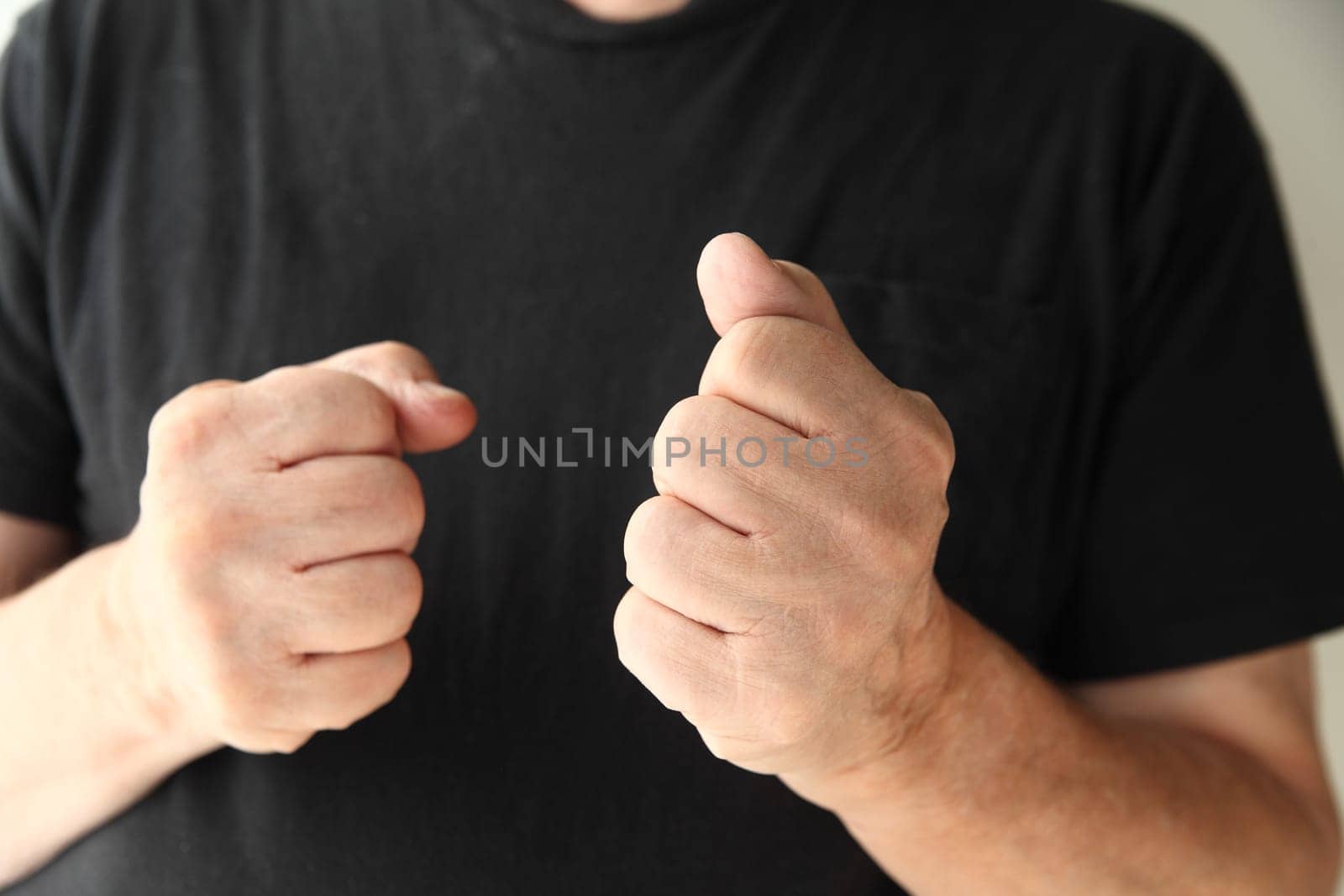 senior man displaying a hostile or aggressive gesture