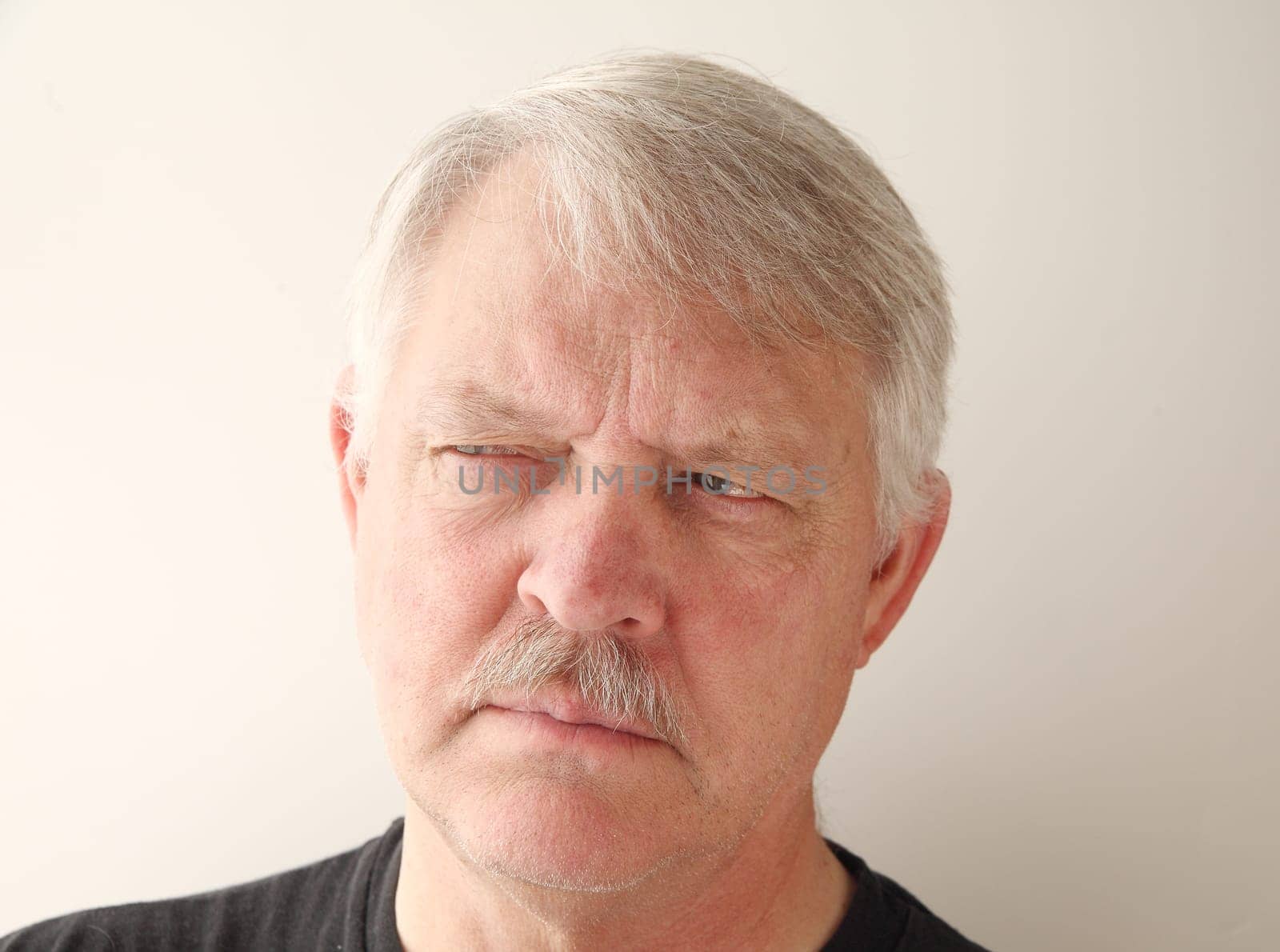senior with a suspicious expression