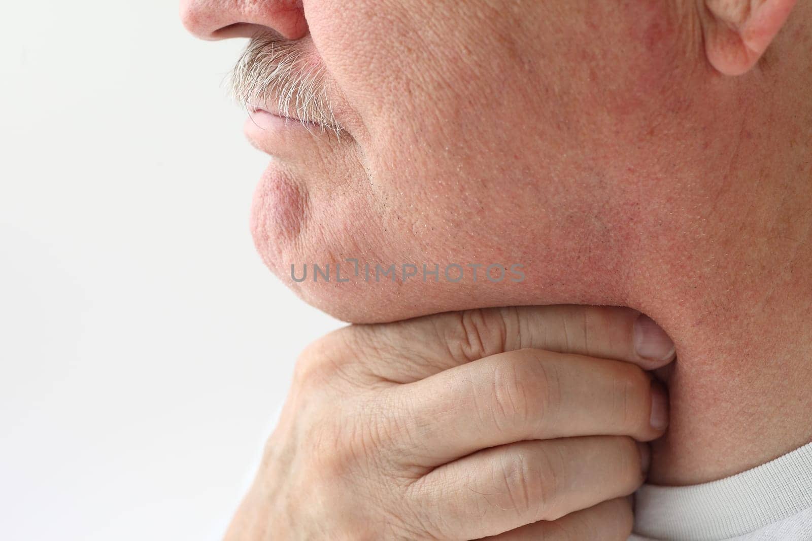 mature man with a very sore throat