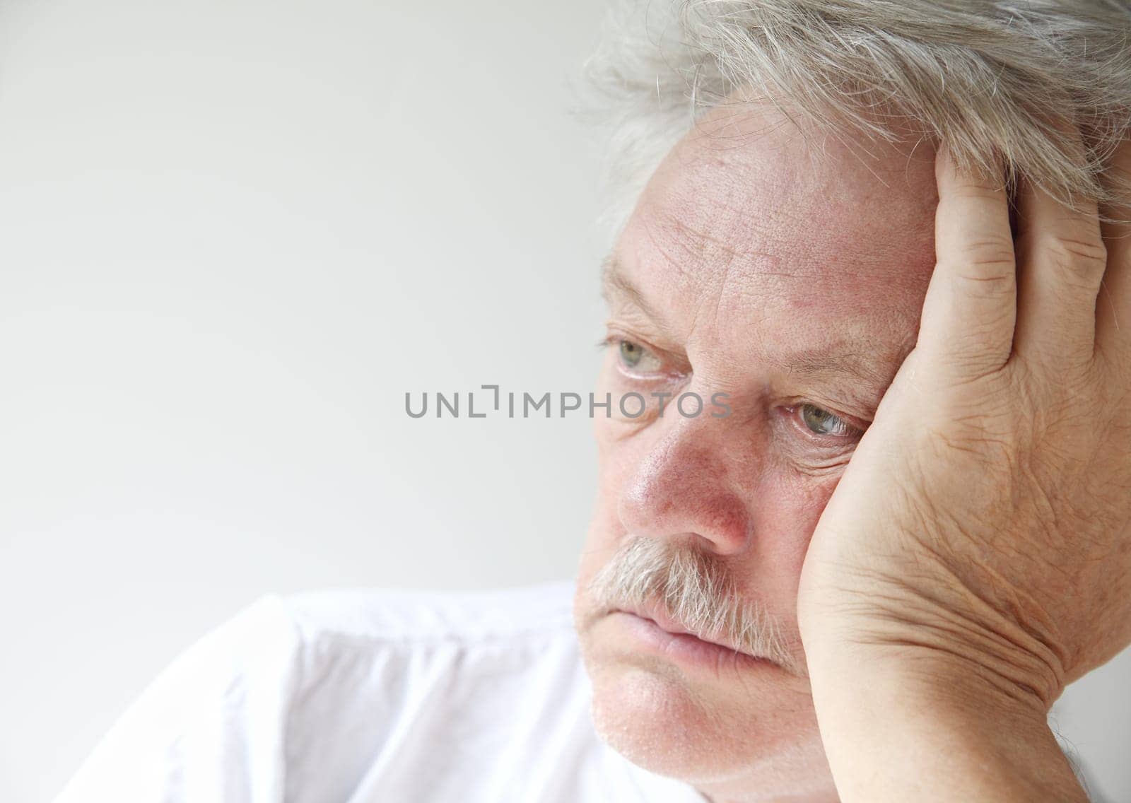 senior man gazes into the distance
