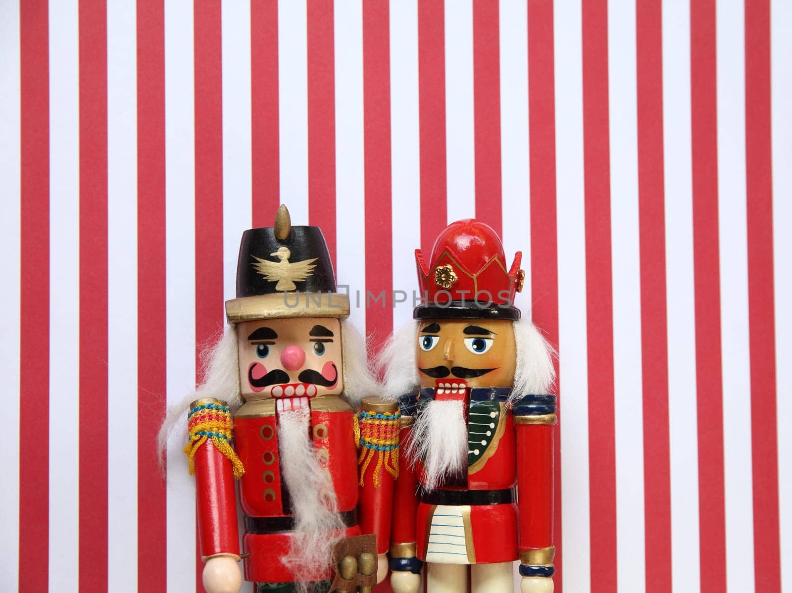 two nutcrackers on a striped background