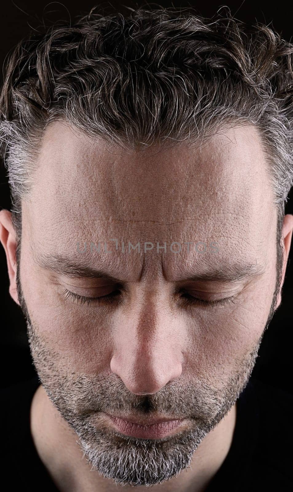 Thinking man with closed eyes