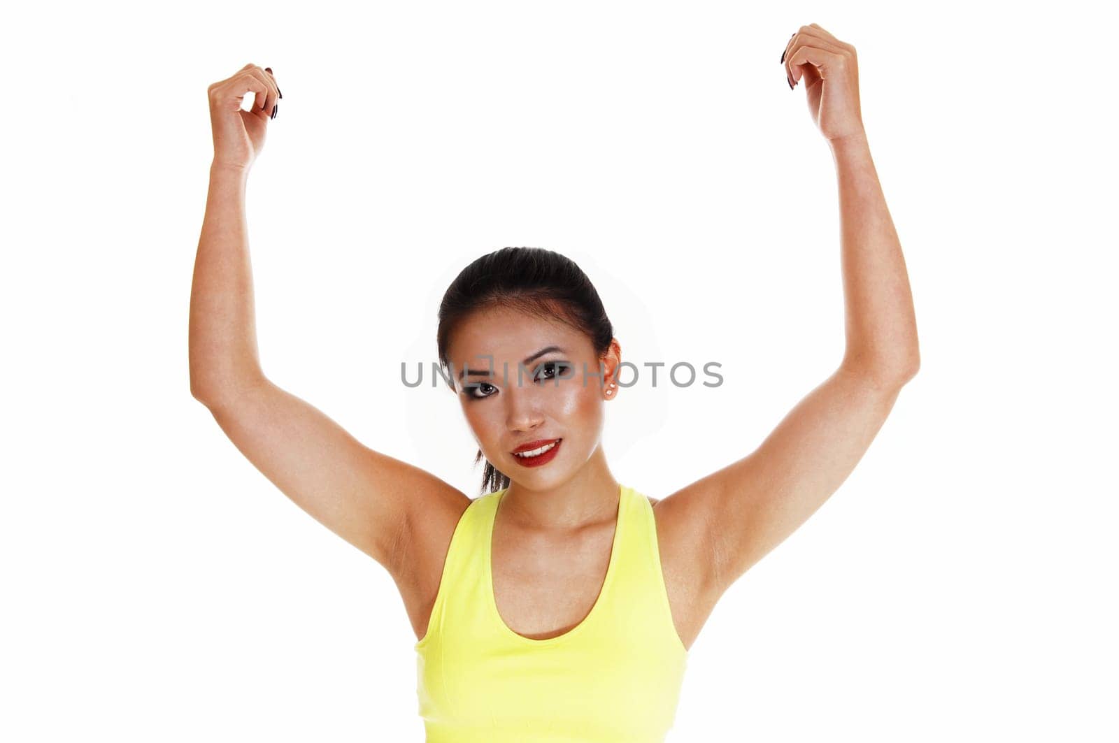 A smiling young Chinese woman in exercise outfit showing off her biceps.with her long black hair for white background..