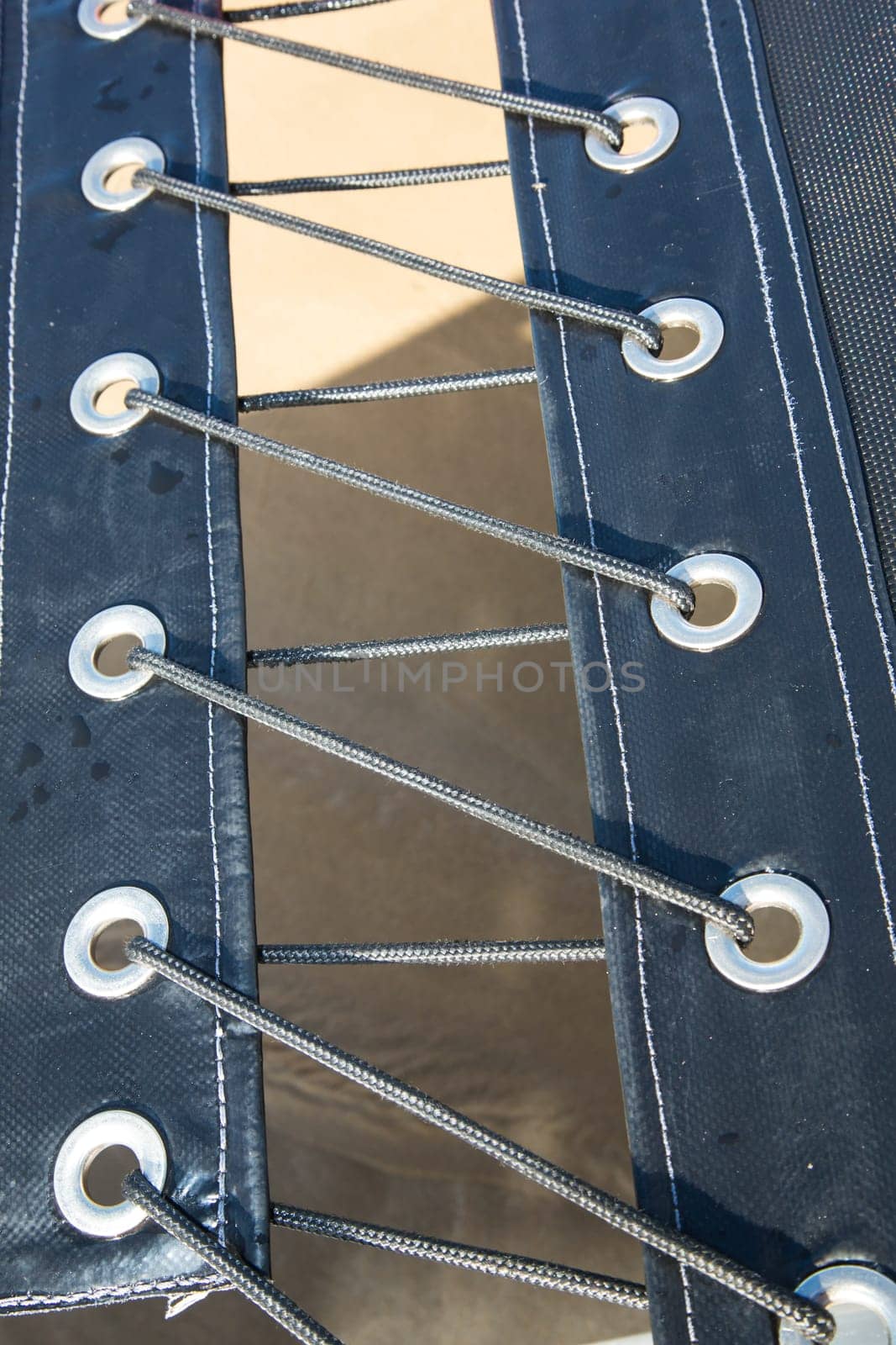 Canvas lashed together with nylon cord on a yacht