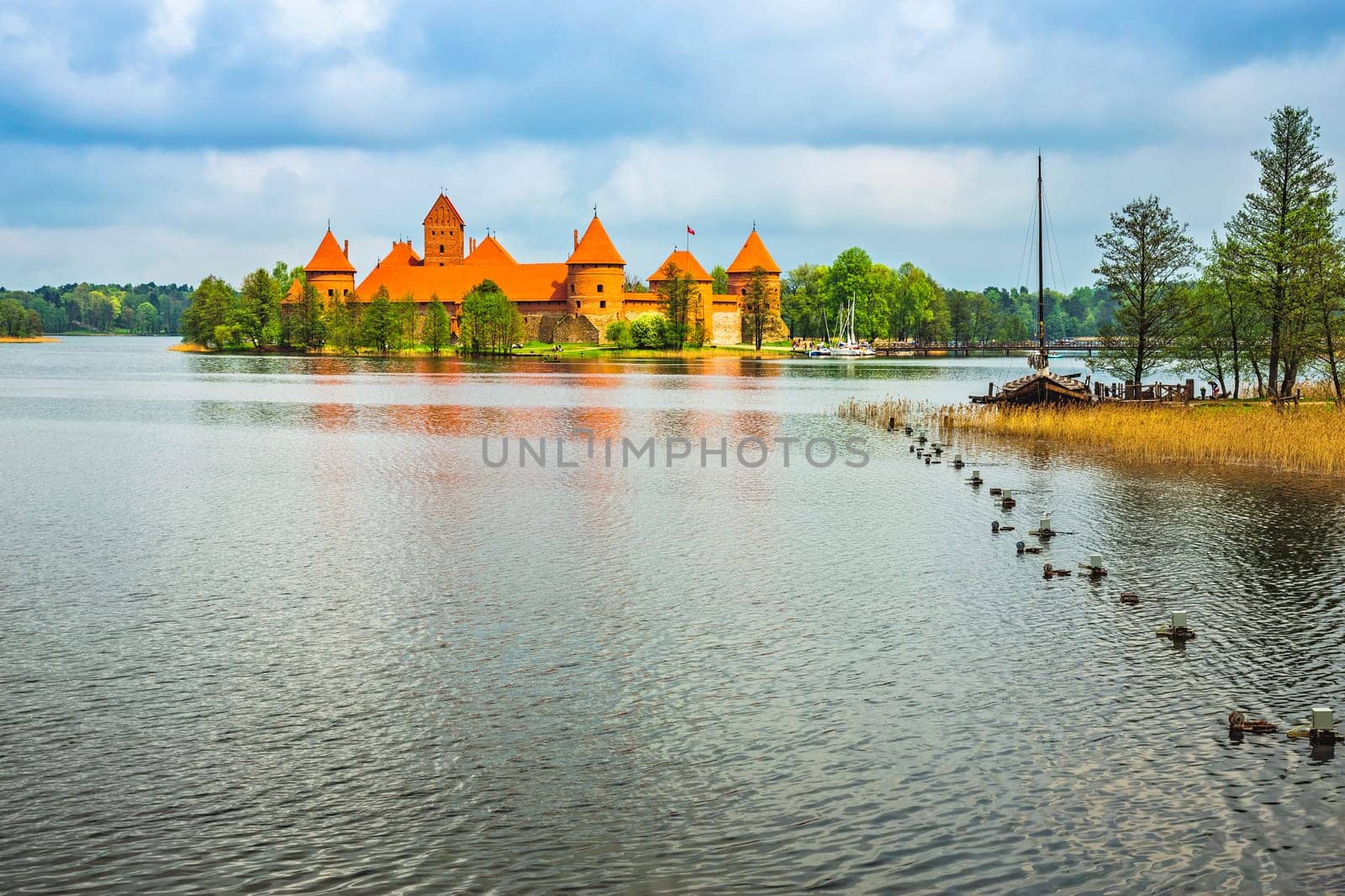 Panoramic view on Medieval old castle in Trakai, Lithuania placed on Galve lake..Island ancient castle are one of the most popular touristic destinations and cultural center in Lithuania.