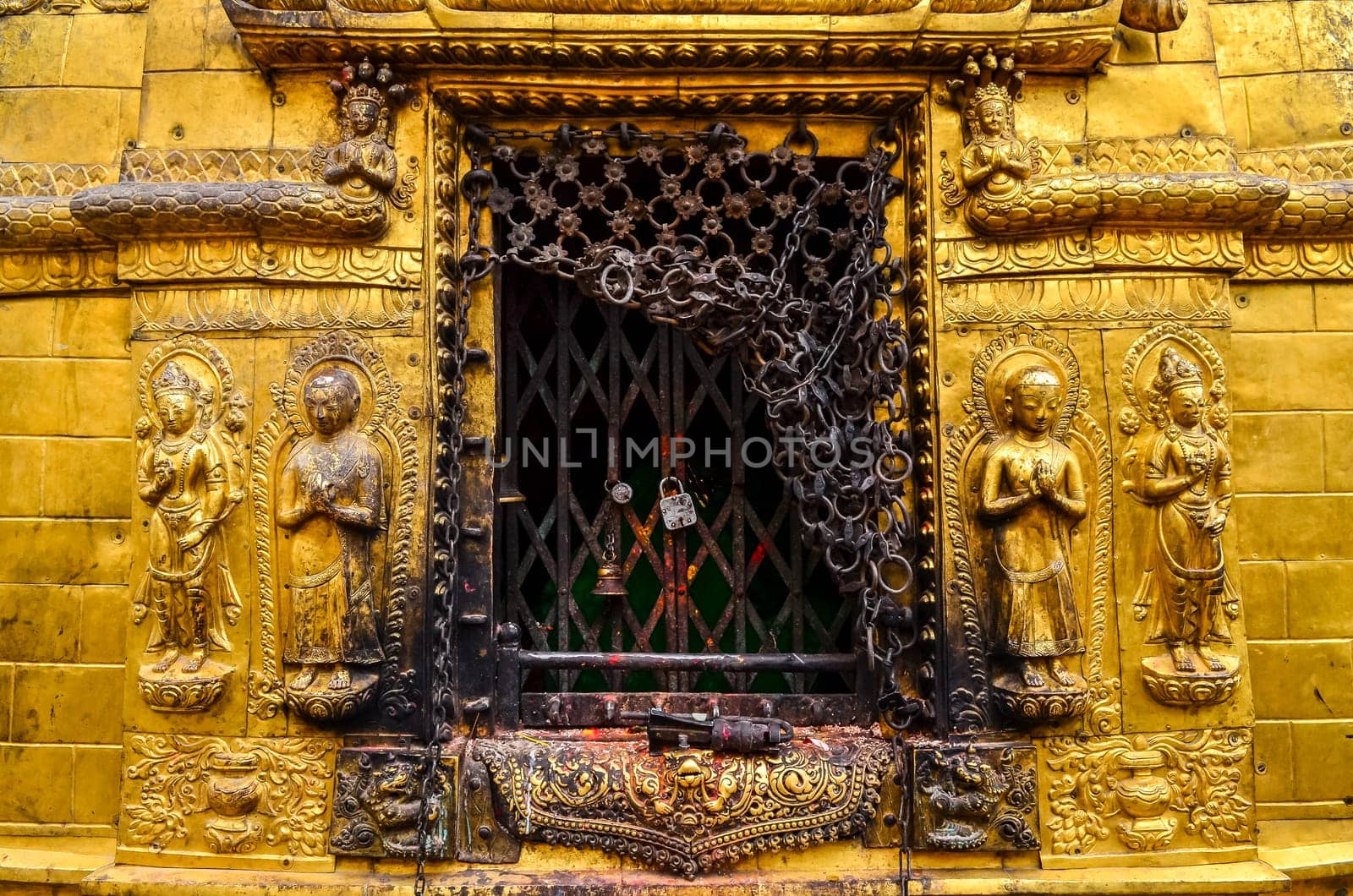 Detail of golden statues in buddhist and hindu temple, Kathmandu, Nepal