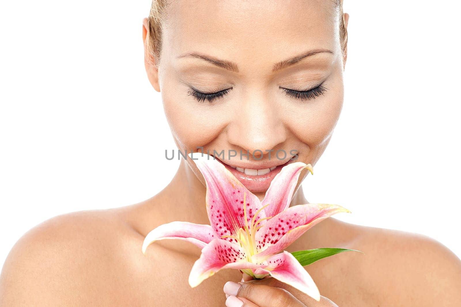 Calm beautiful lady holding lily flower