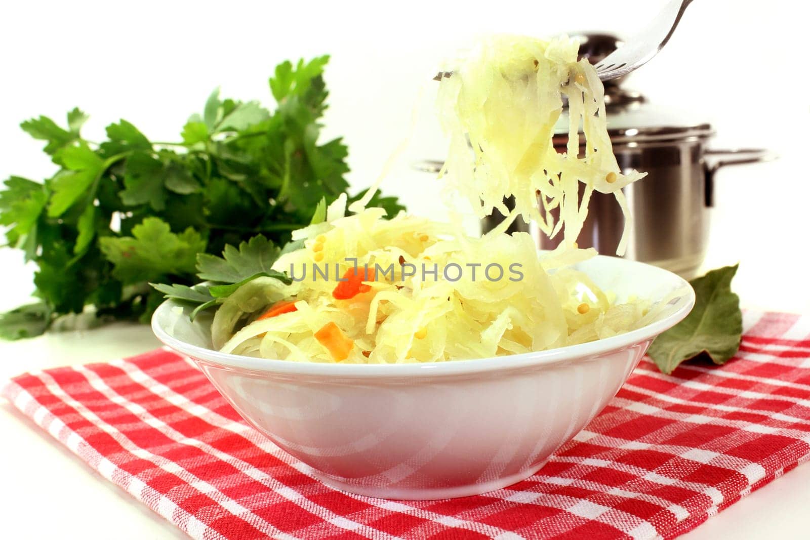 fresh sauerkraut with carrots and laurel