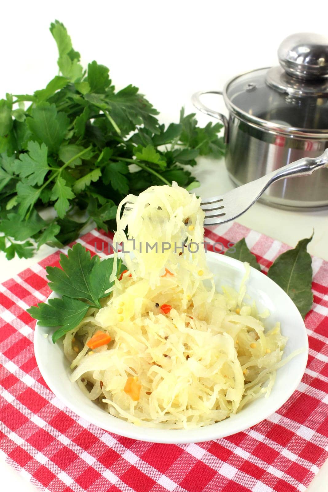 fresh sauerkraut with carrots and laurel
