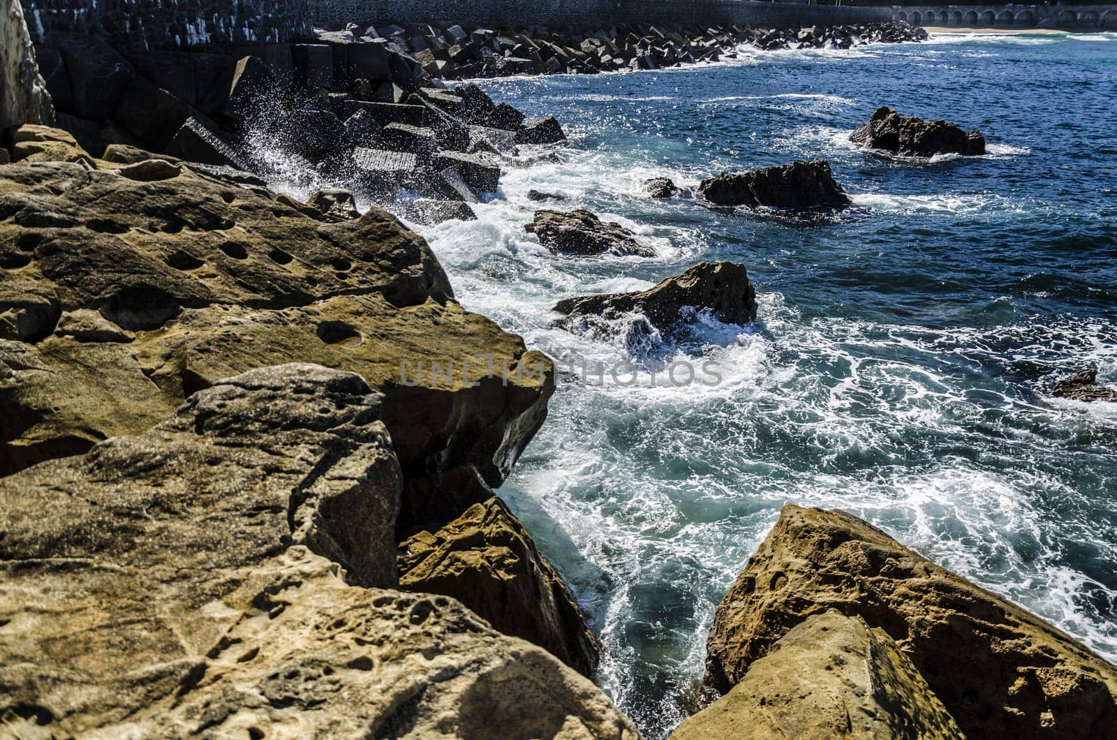 Beautiful and very detailed rocks, with nice, colorful and clean water background. This image is perfect for texture using and for precise and detailed working. The image is takken in Getaria city, Spain, at the Atlantic ocean.