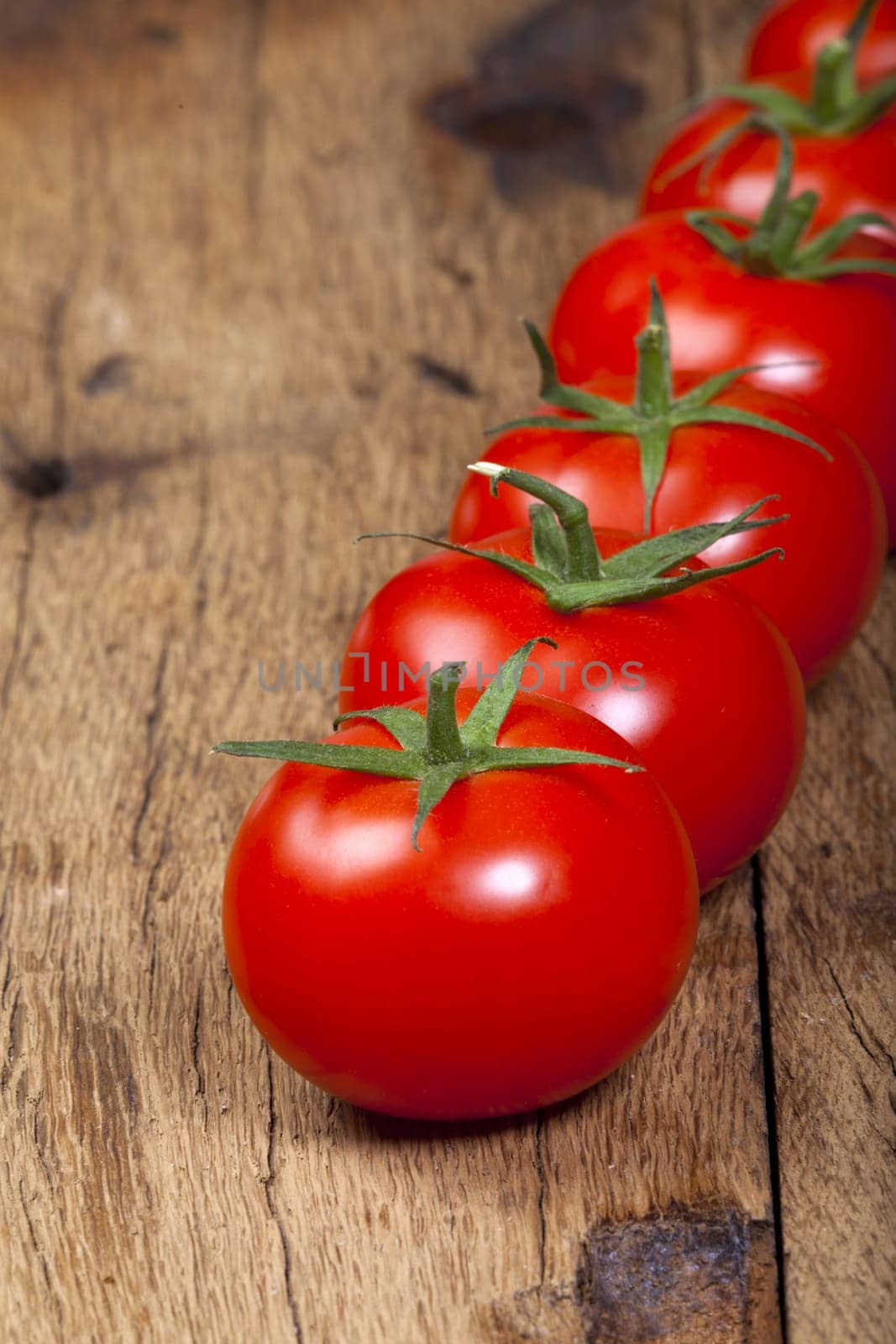 Close-up ripe tomatoes in a row