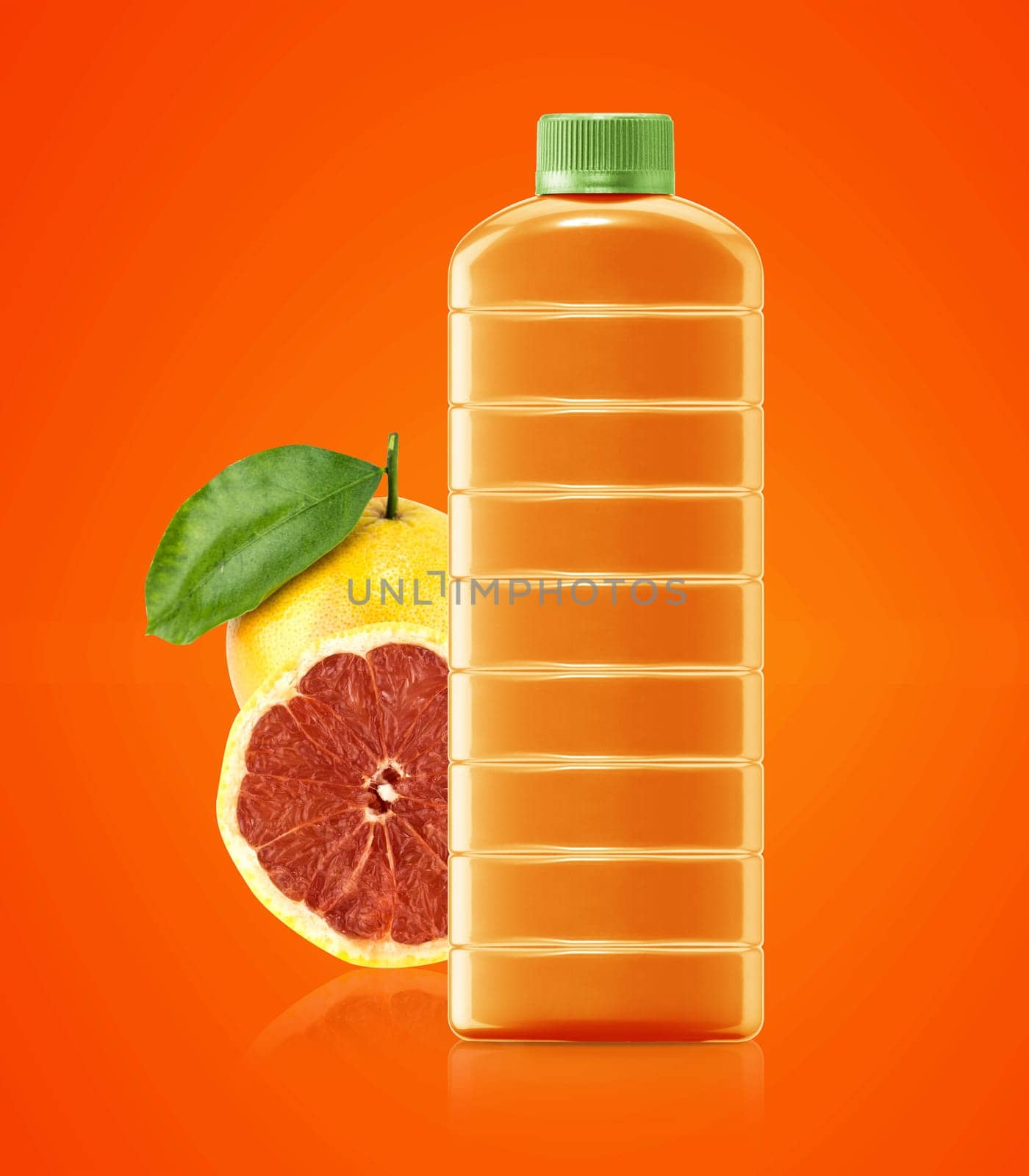 grapefruit  juice in a plastic container jug with fresh orange and leaves on a white background.