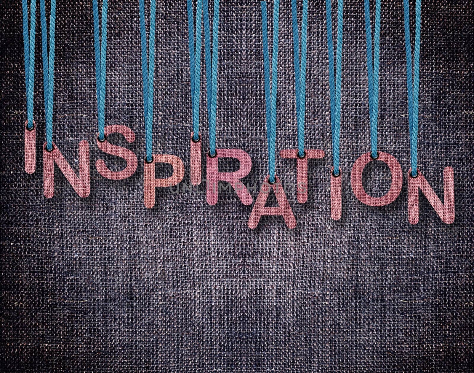 Letters hanging strings with blue sackcloth background.