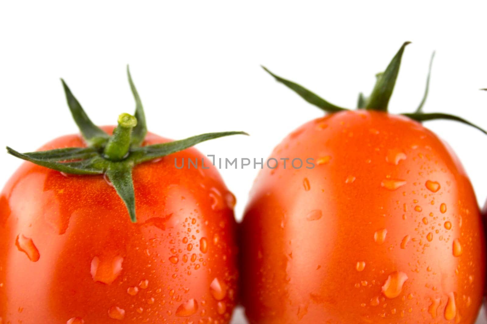 Fresh red tomato with green stem on white background