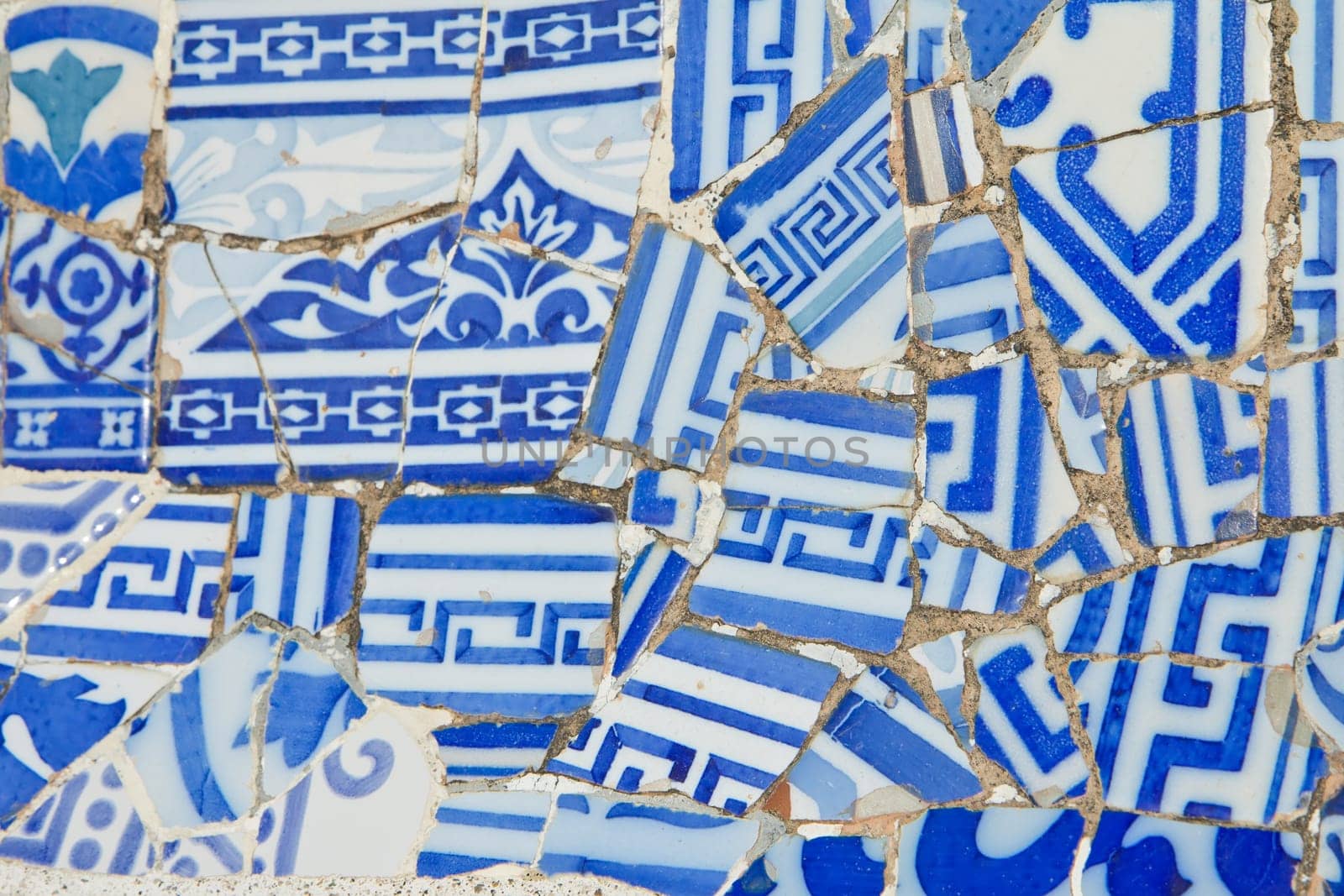 Detailed view of a ceramic mosaic - blue and white (Barcelona, ​​Catalunya, Spain)