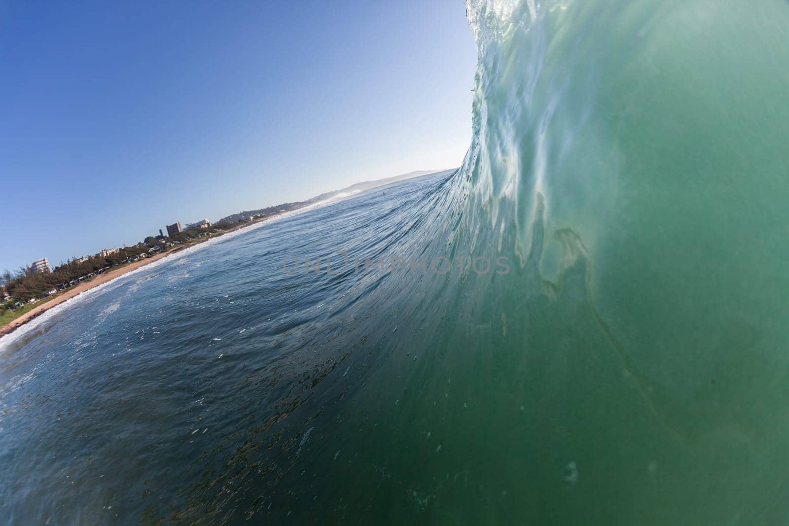 Ocean wave wall from storm swells crashing along shallow beach reef with natures  energy, a swimming photo of sea power.