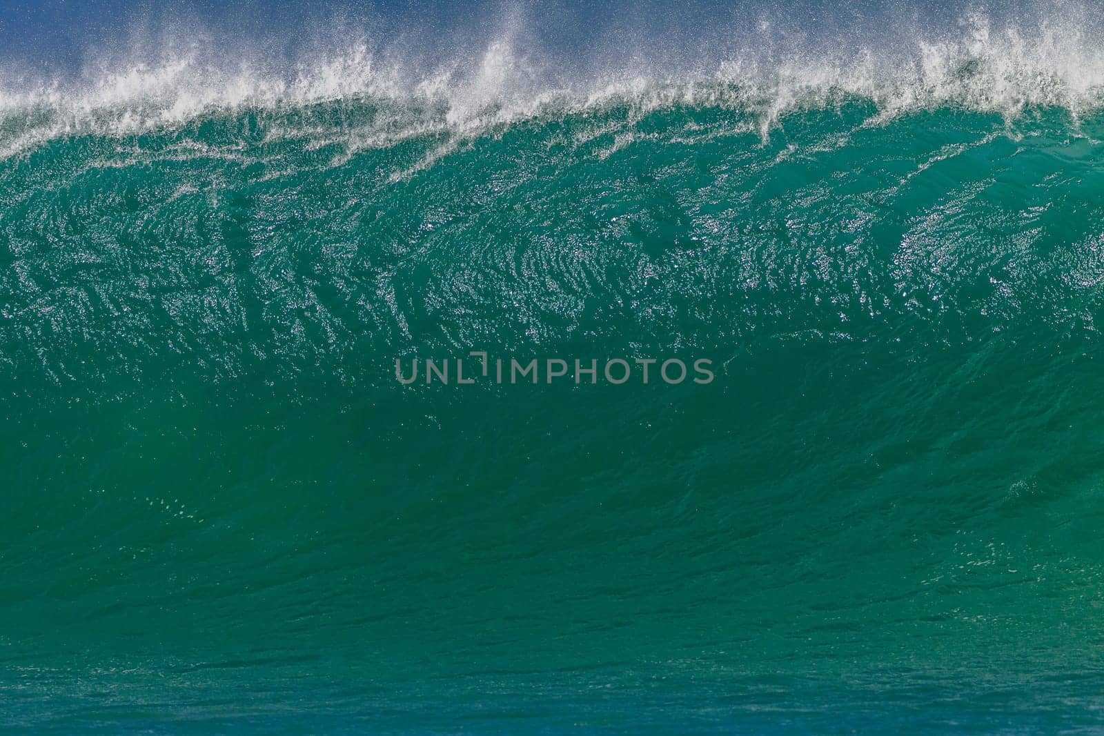 Ocean wave wall from storm swells crashing along shallow beach reef with natures  energy, a swimming photo of sea power.