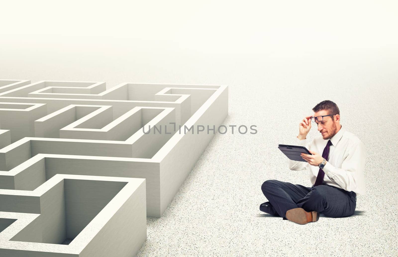 businessman use tablet 3d maze background