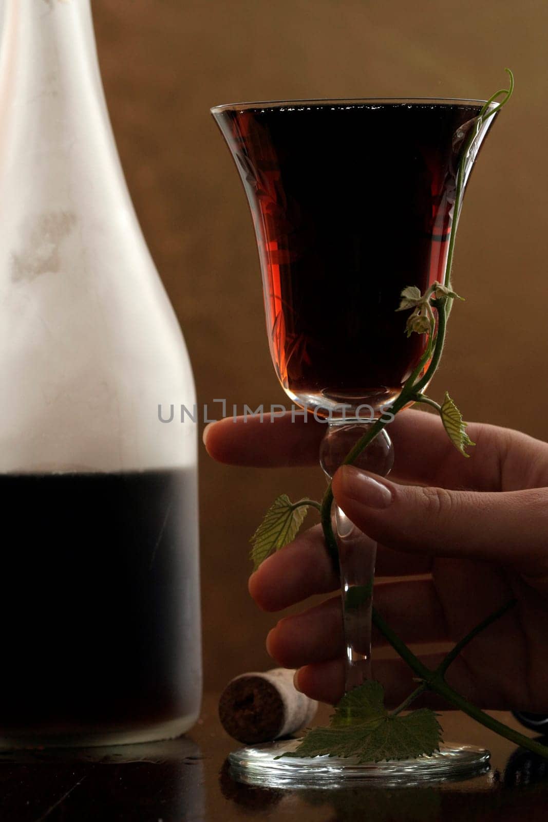 red wine glass and bottle