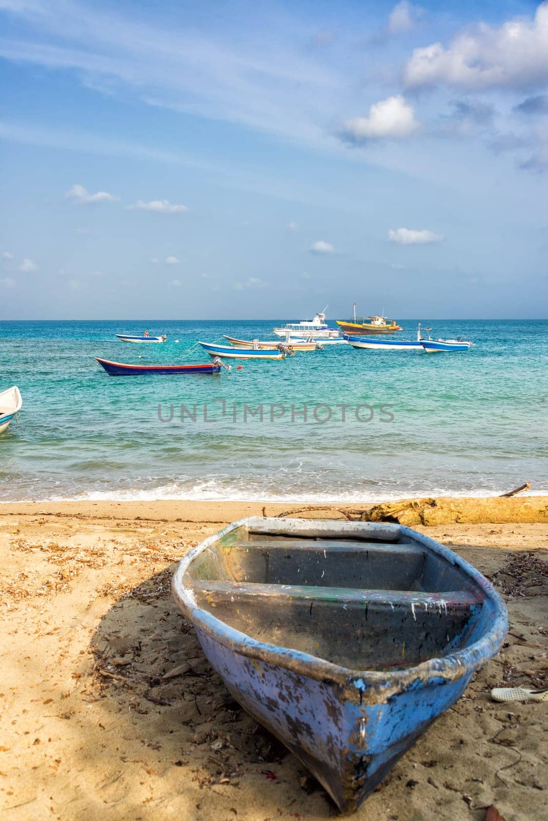 Boat on a Beach in Capurgana, Colombia with boats in the background