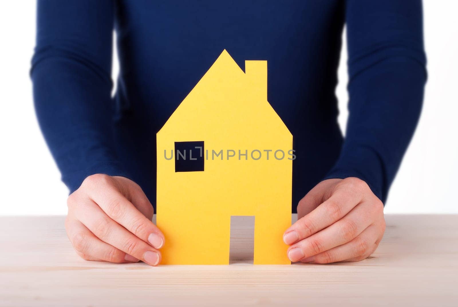 A Woman is Holding a House between her Hands, Isolated