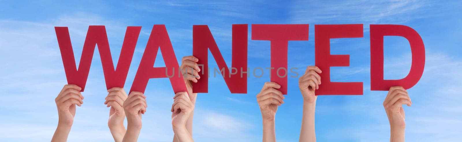hands holding four pieces of a puzzle with copy space, gray background