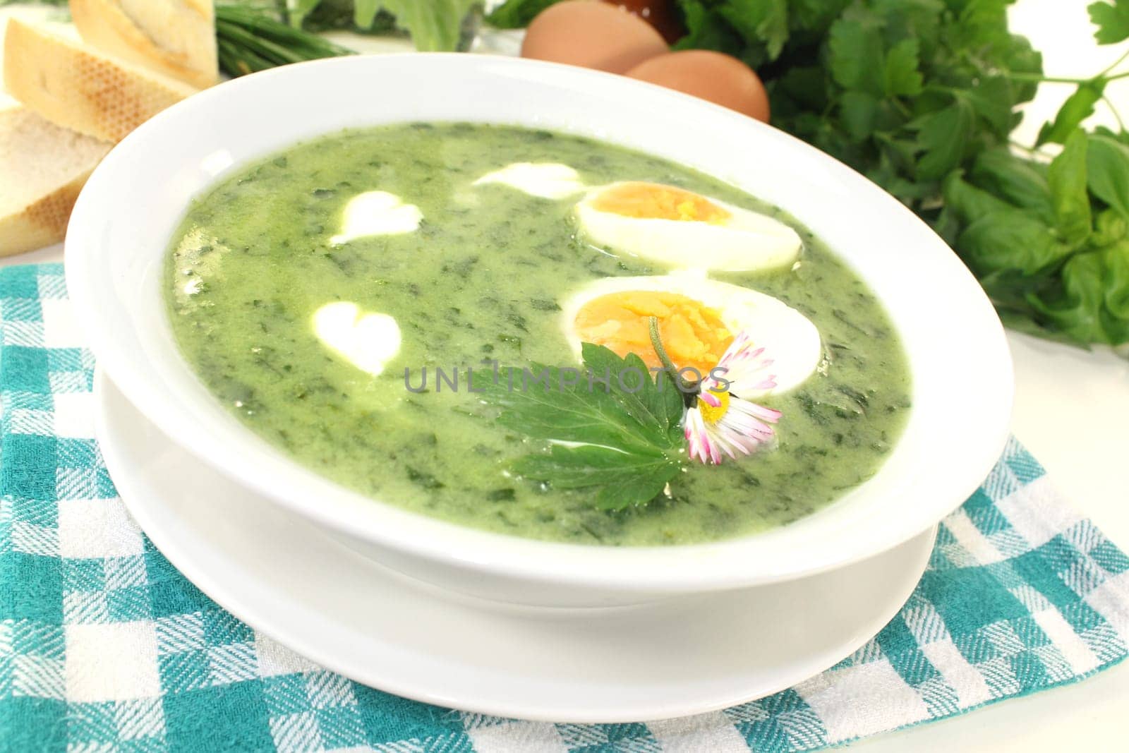 a green herb soup with eggs and creme Fraich