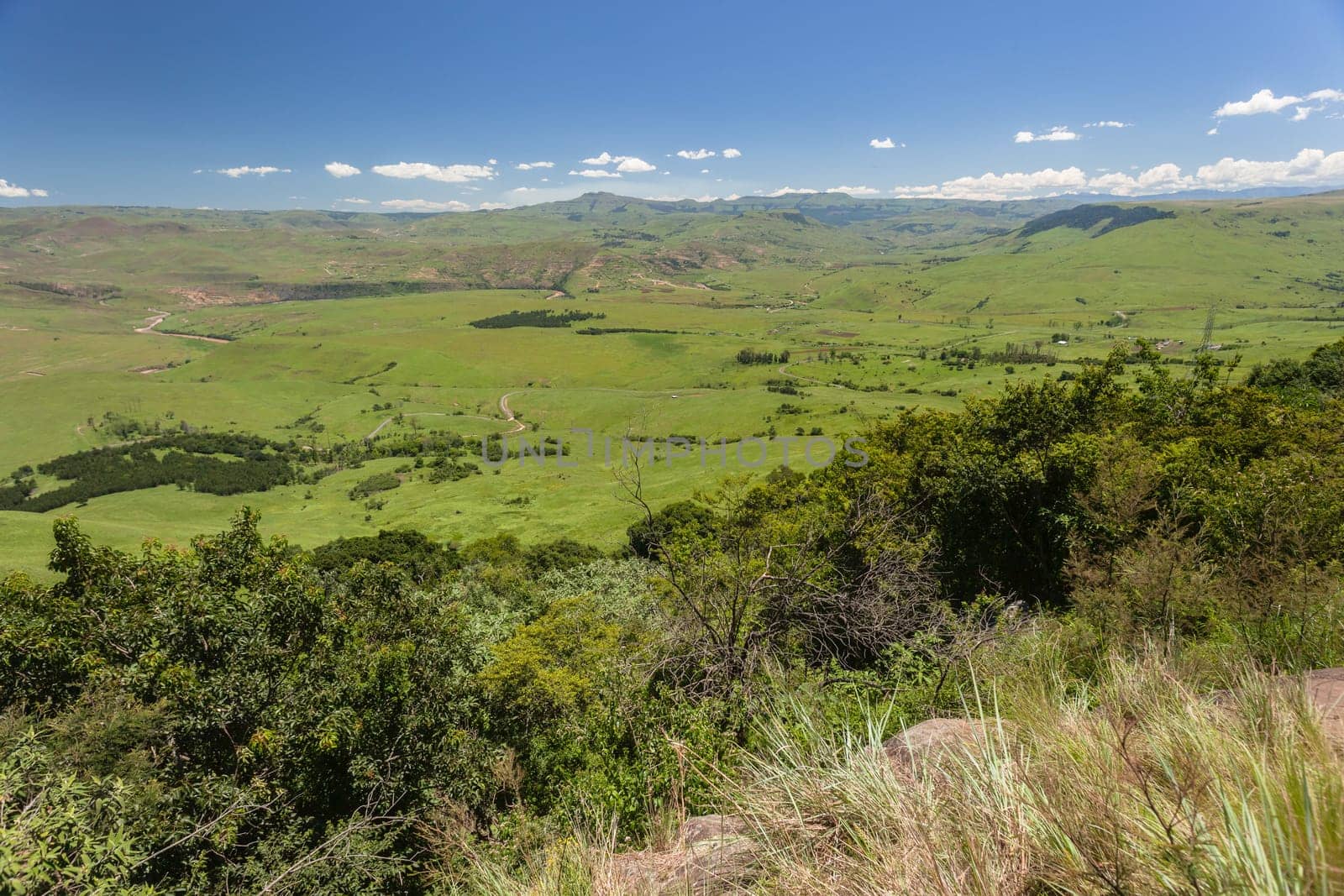 The Umkomass valley landscape in summer green blue  sky day in the Southern Drakensberg mountains South-Africa