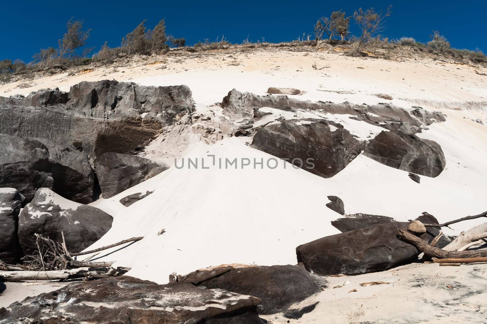Rainbow beach color sands and rocks alongside ocean sea embankment