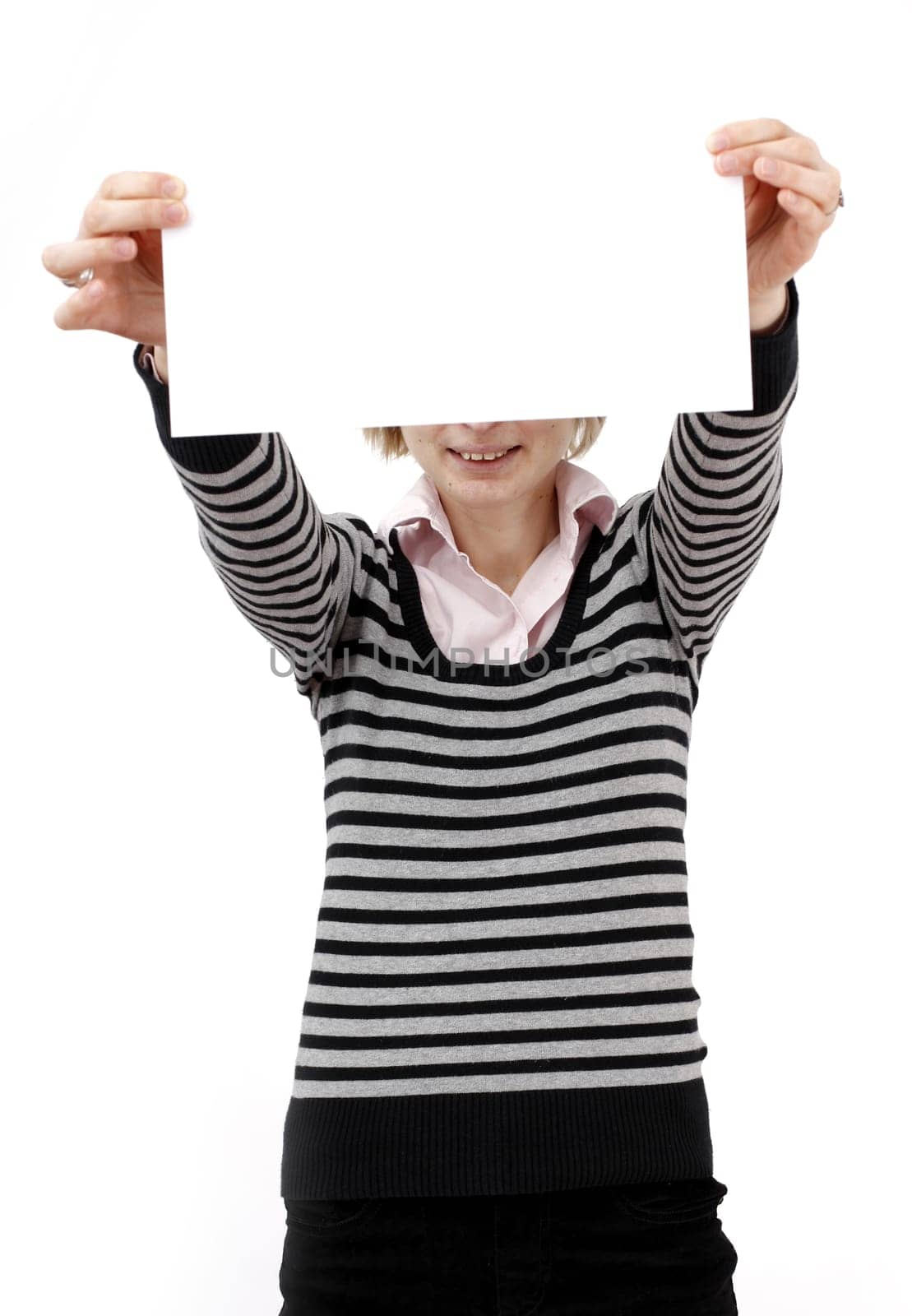 Young blonde woman holding a blank piece of paper.