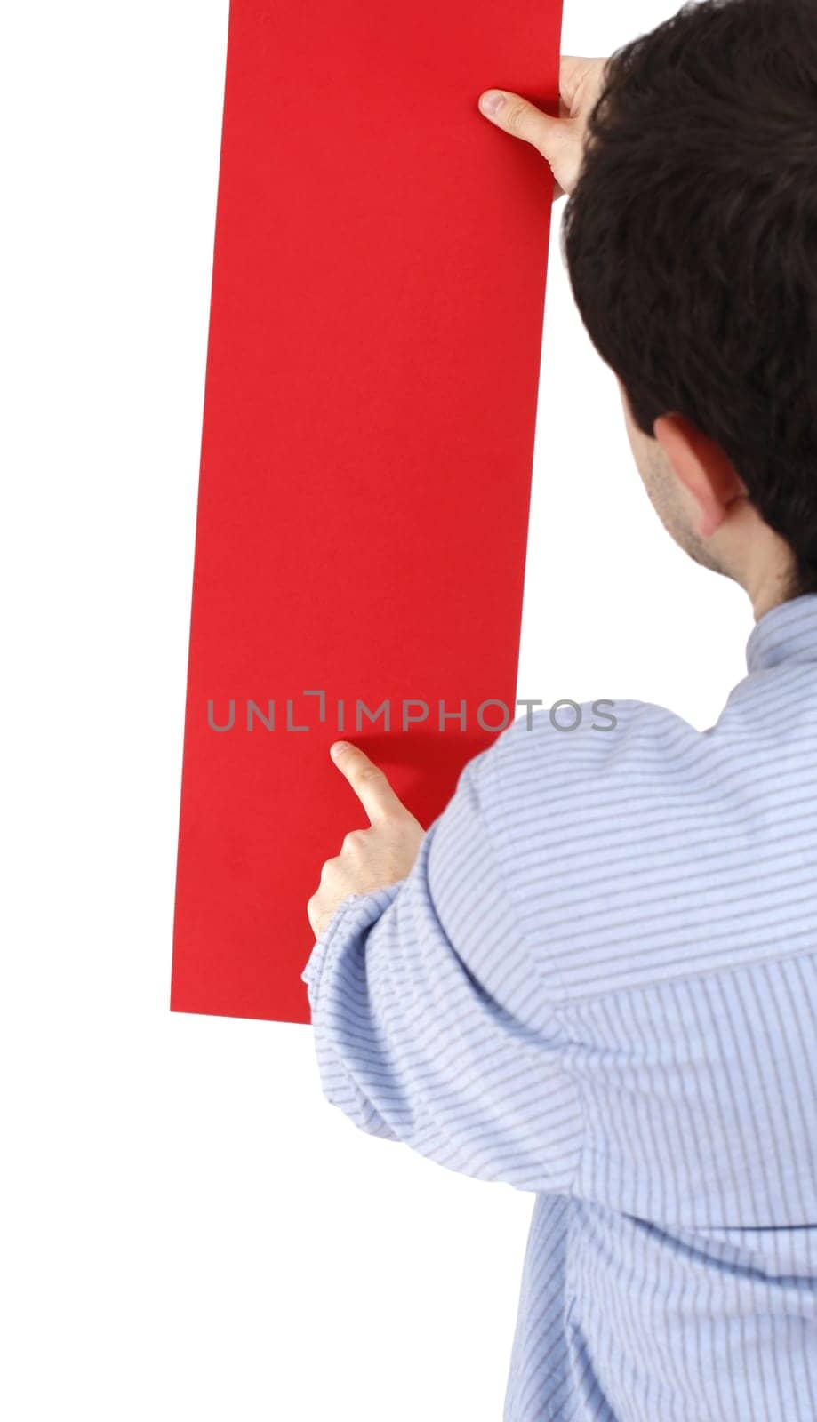 Young man holding a blank piece of paper