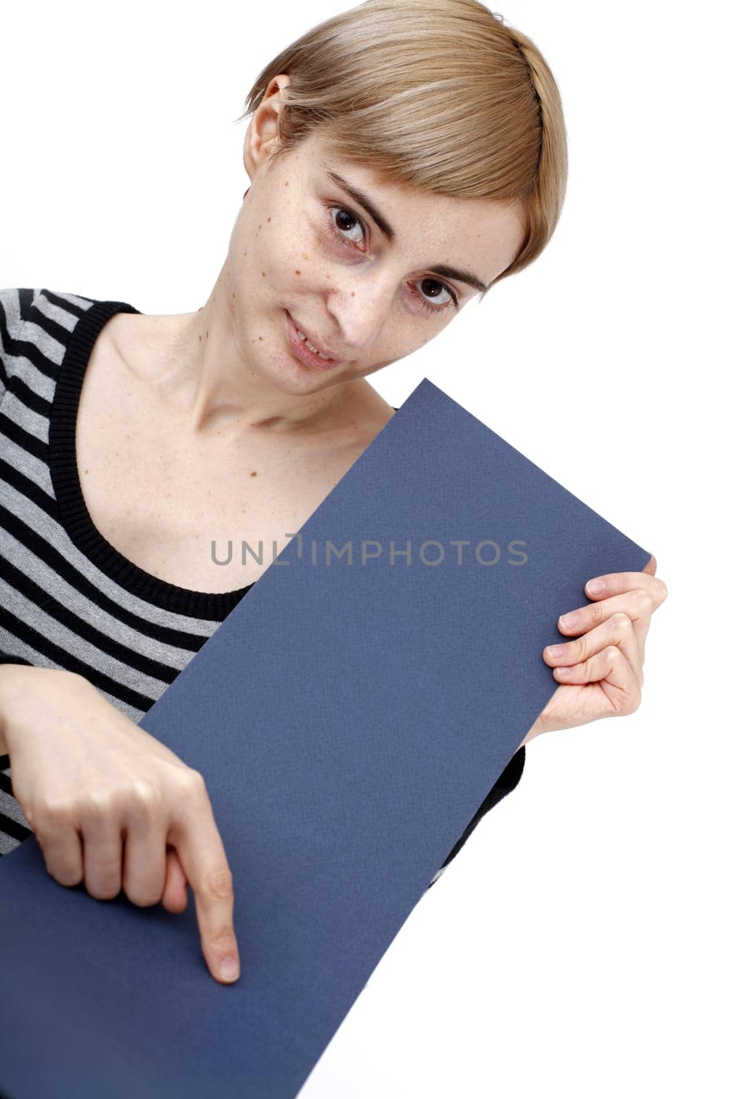 Young blonde woman holding a blank piece of paper.