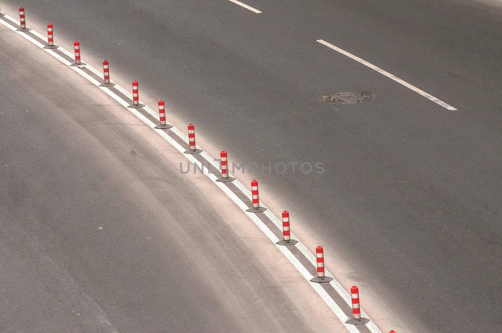 Part of used asphalt roadway with road marking lines