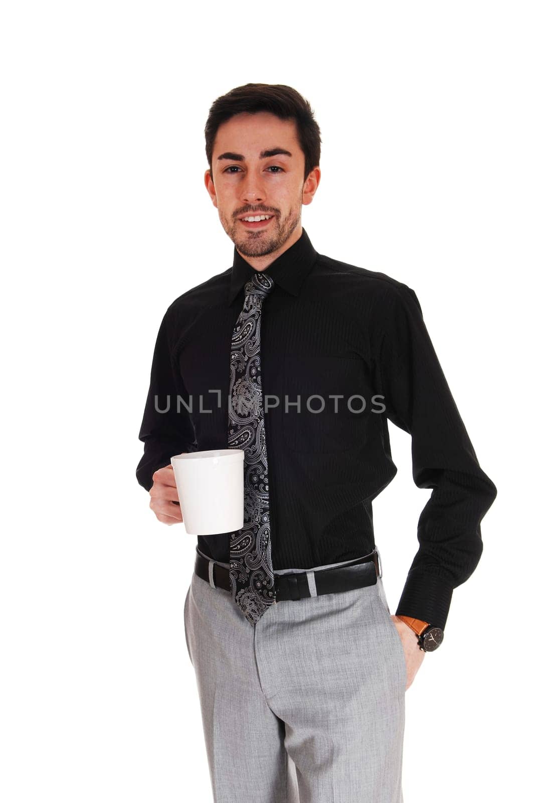 A young businessman standing isolated for white background holding.a coffee cup in his hand..
