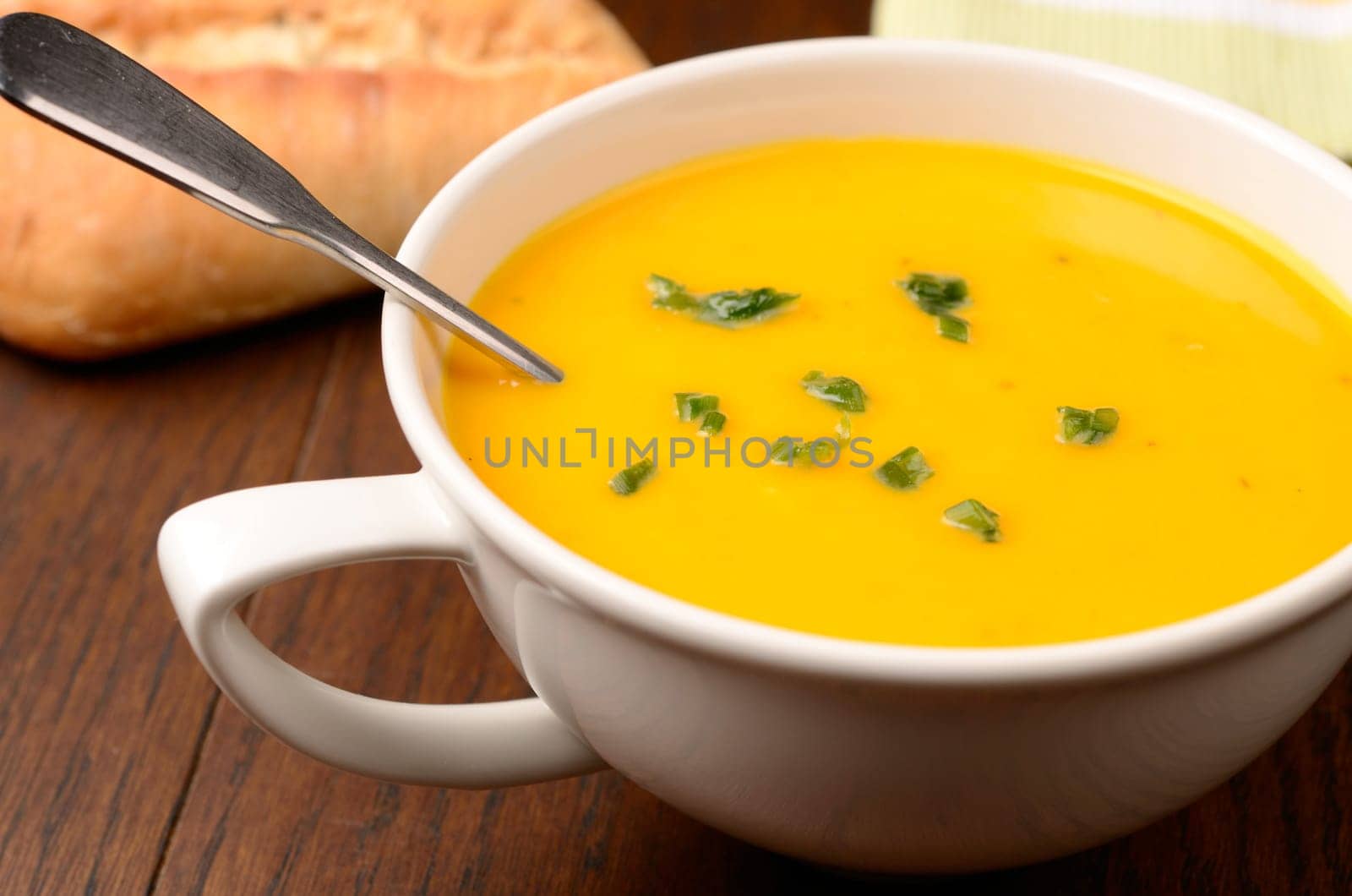 Hokkaido pumpkin cream soup on a kitchen table