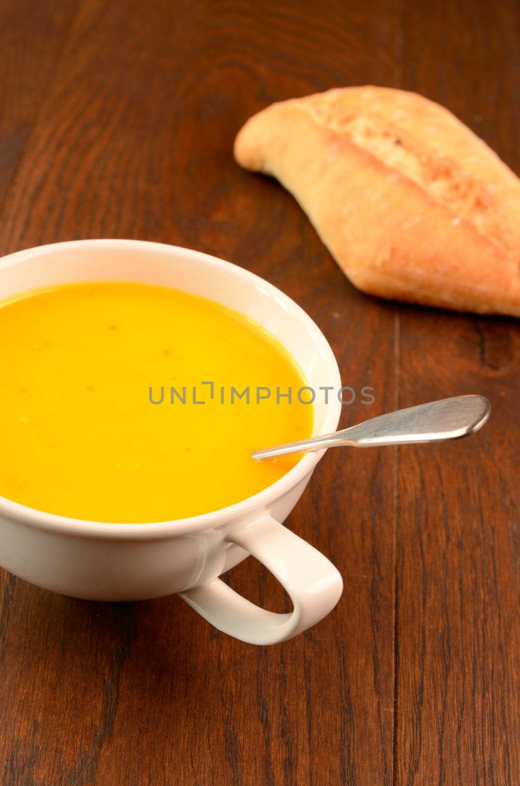 Hokkaido pumpkin cream soup on a kitchen table