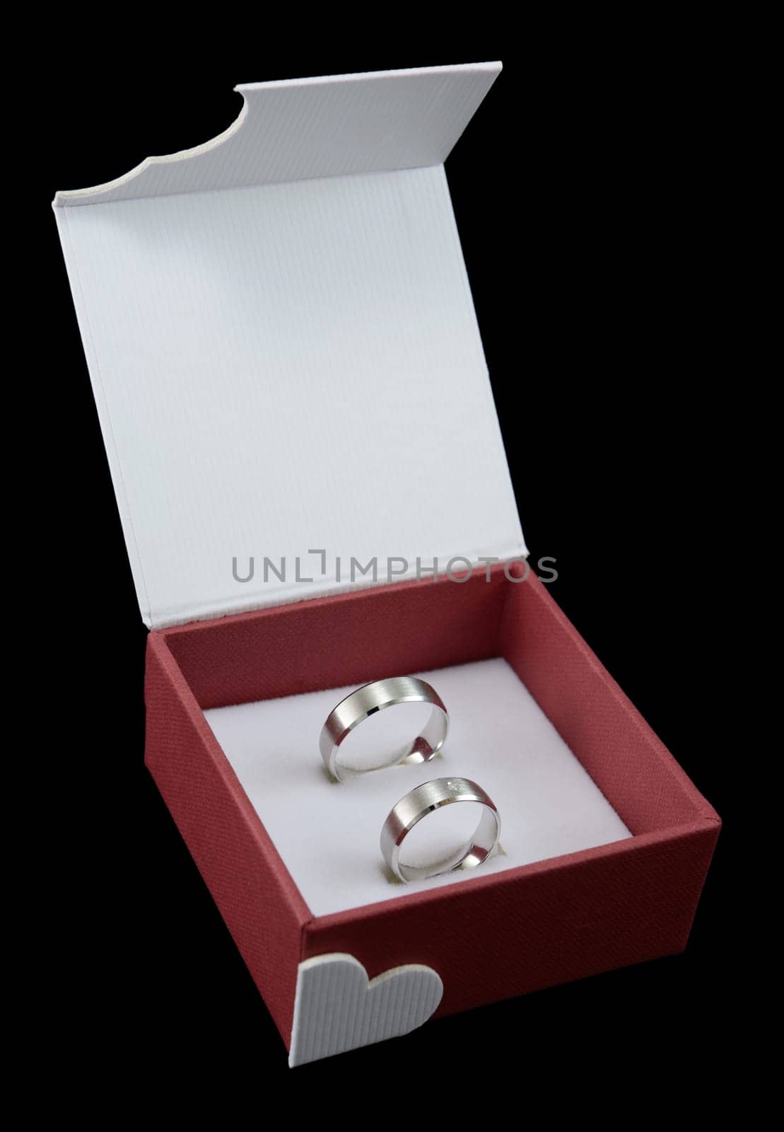 Pair of wedding rings in open box, isolated on black.
