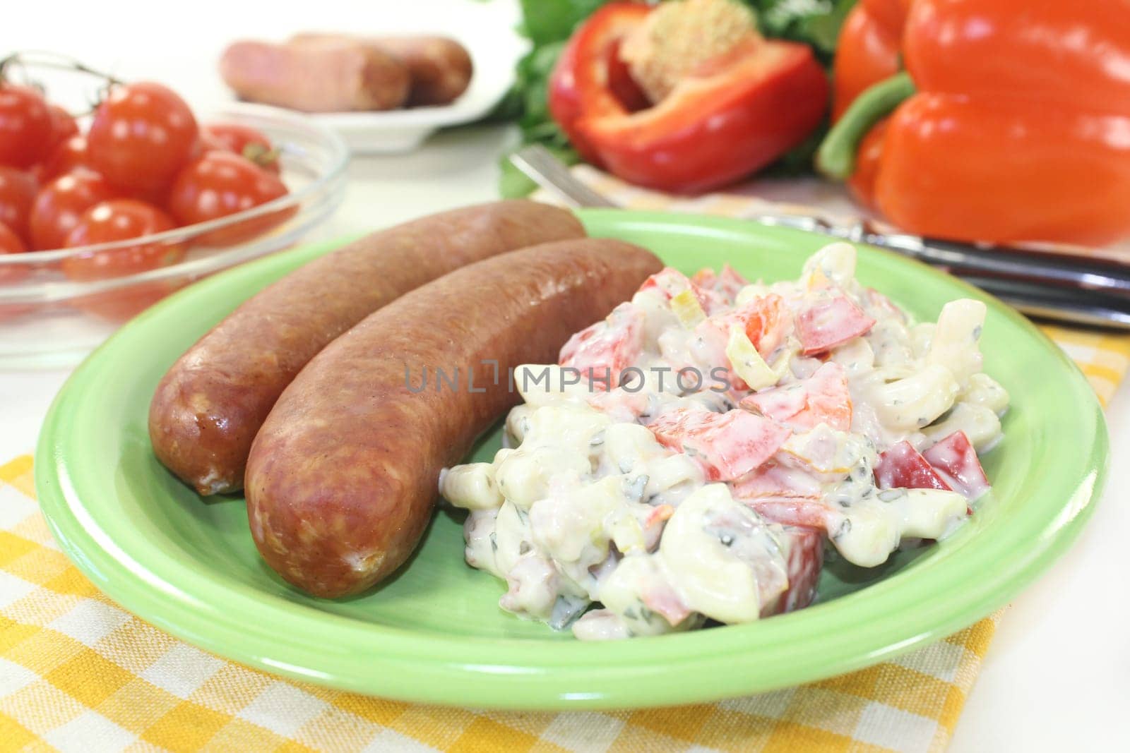 Mettenden with pasta salad against a white background
