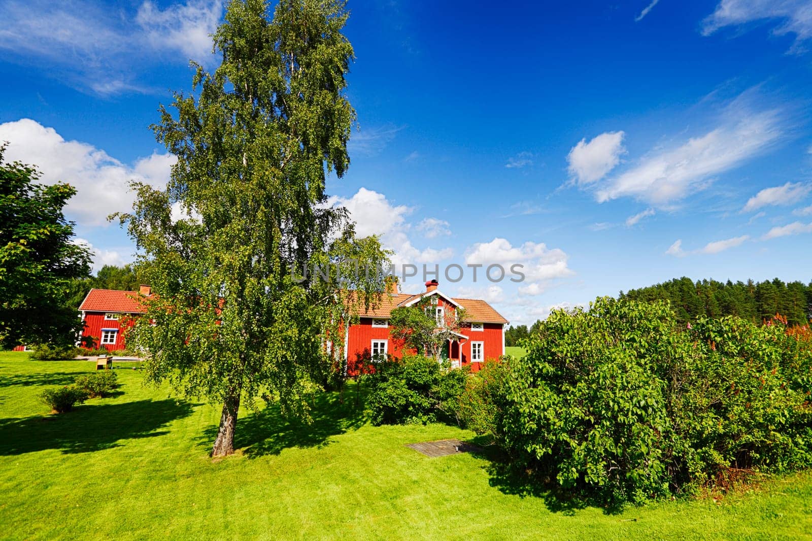 old 17th century red cottages set in a rural landscape, scenery from Sweden