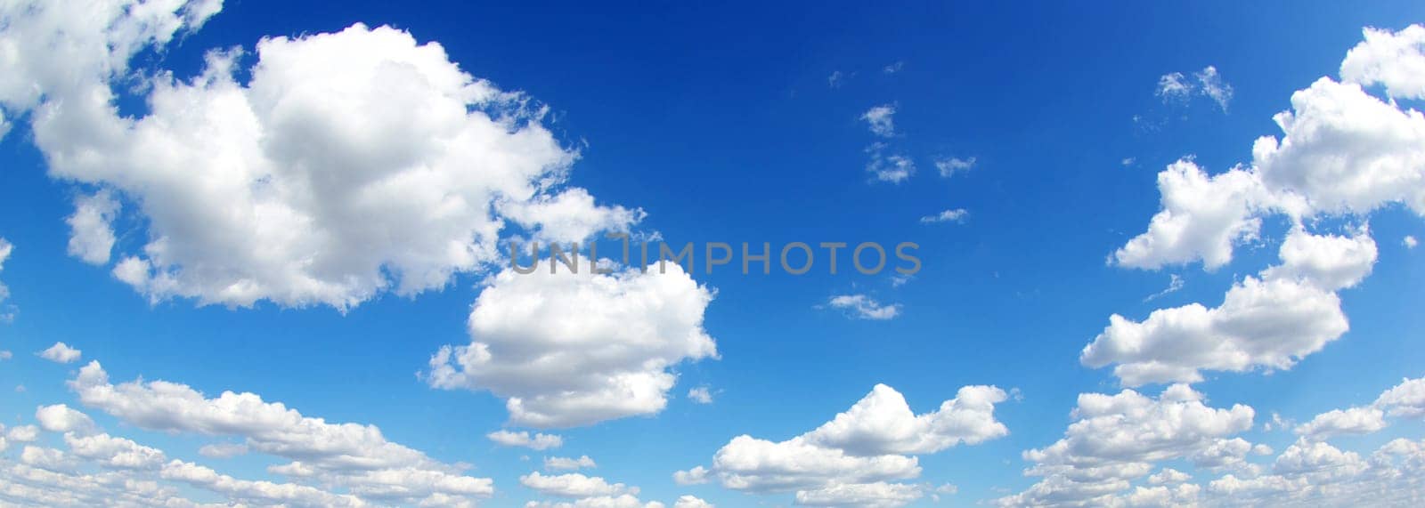 blue sky background with tiny clouds