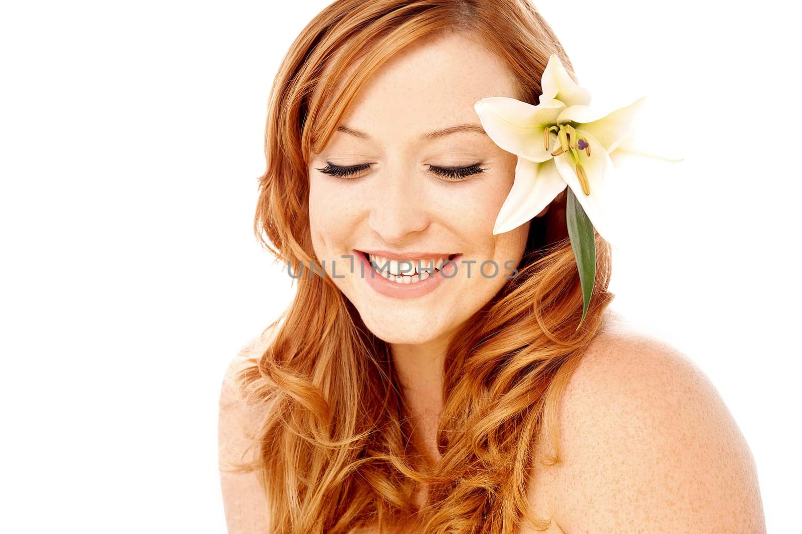 Charming young woman with white lily flower